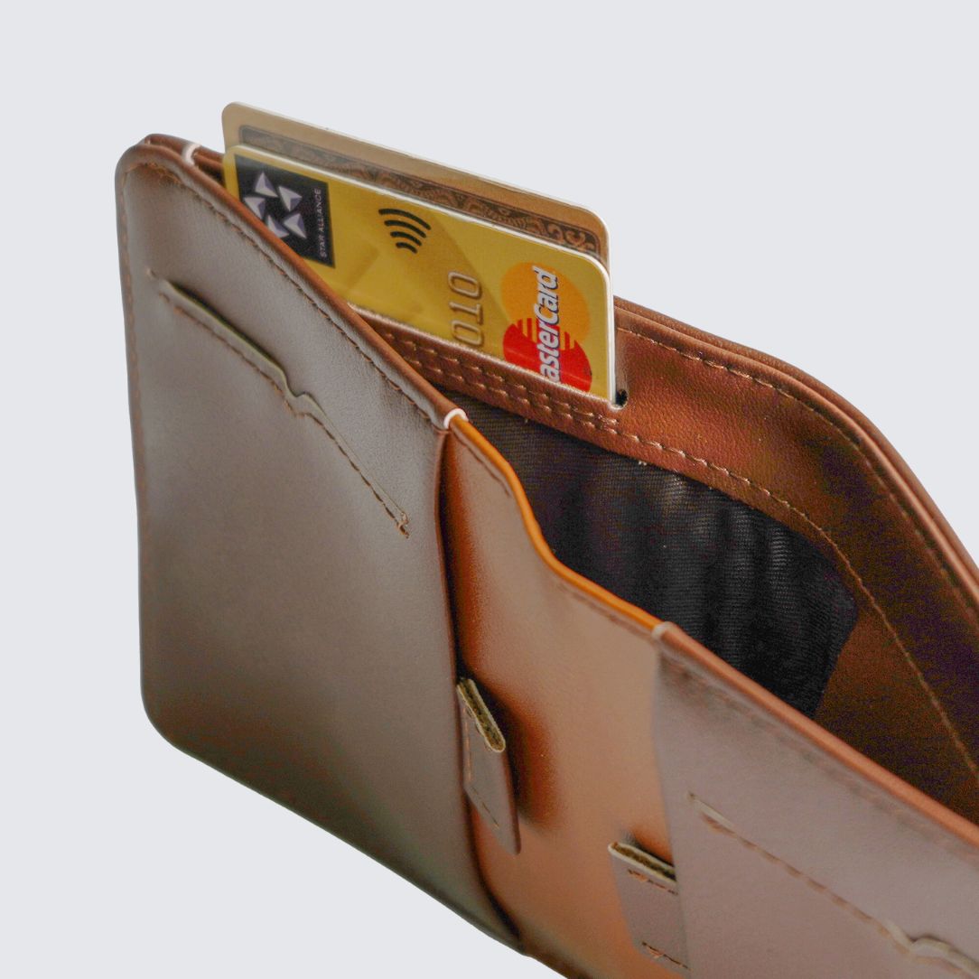 Brown color FREO Airtag Wallet two pull tabs for storing up to 8 additional cards