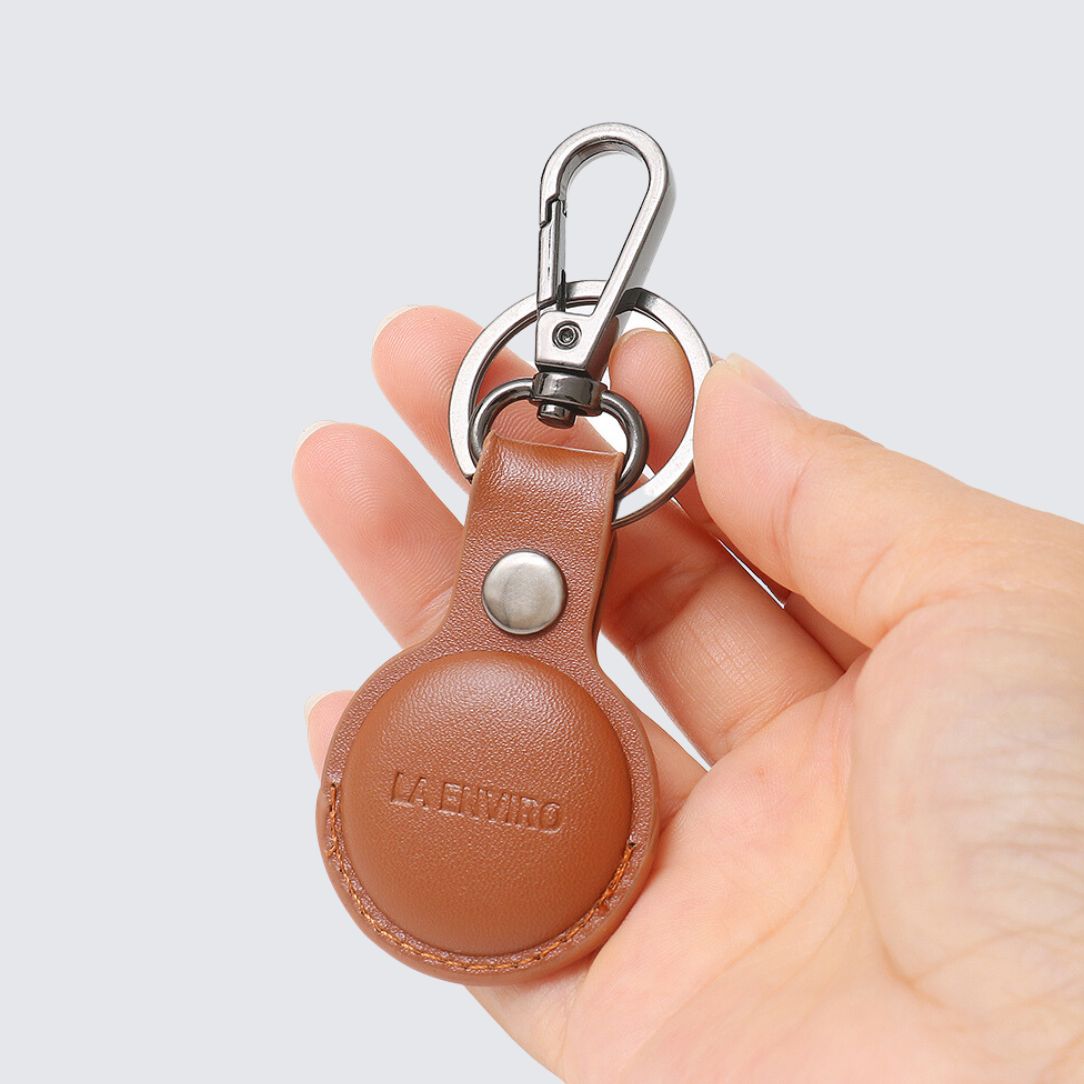 La enviro tan side of black color TILBA Airtag Keyring